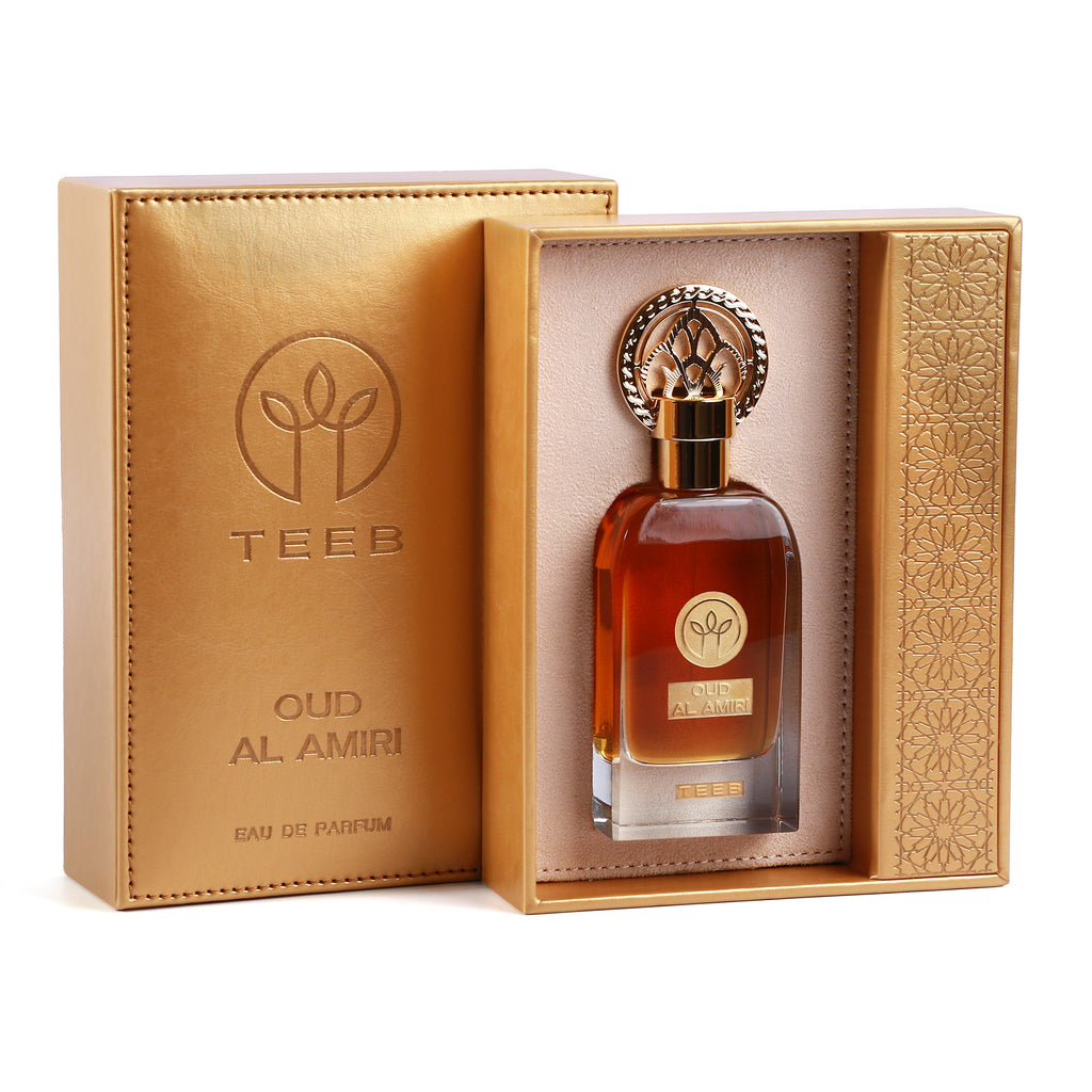 Gold TEEB Oud Al Amiri box open with the bottle in a cream-lined tray next to its embossed cover