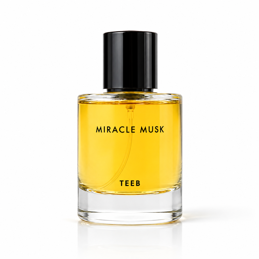 Miracle Musk Eau de Parfum bottle with golden-yellow liquid and black cap on a white background