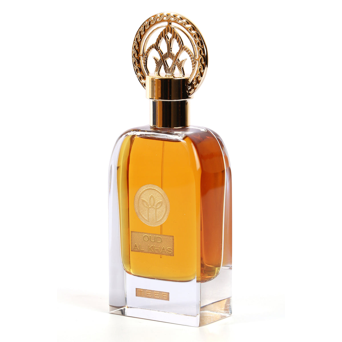 Oud Al Khas bottle with amber liquid and ornate gold cap, seen at an angle