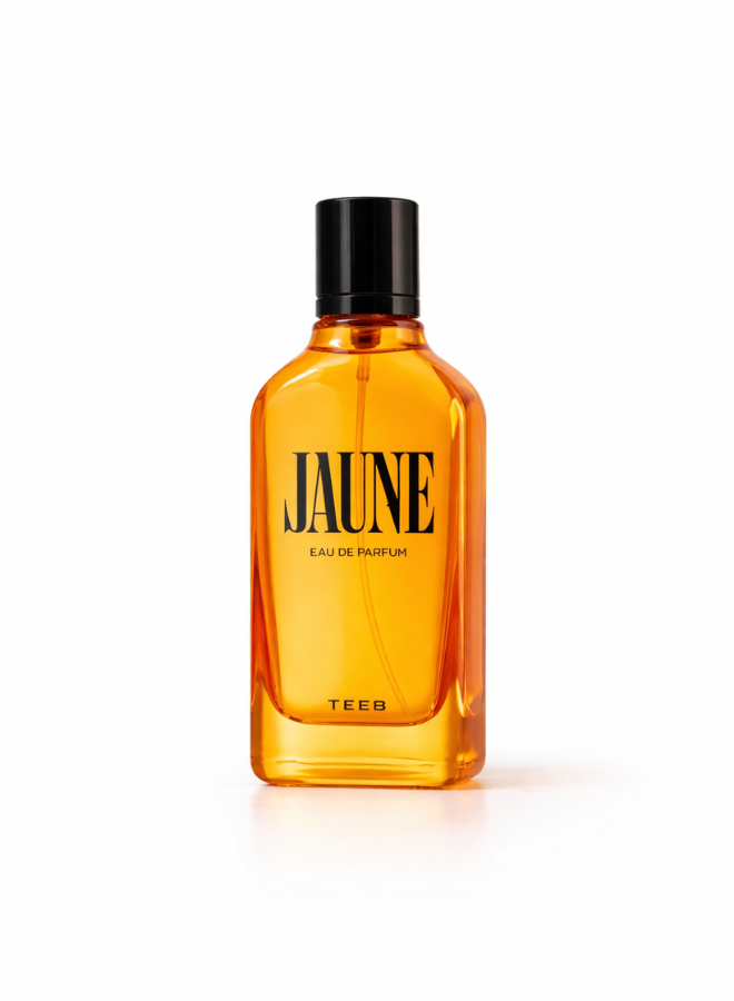 Jaune Eau de Parfum amber-orange glass bottle with black cap on a white background