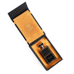 Open black Ciel Nuit gift box with tan lining and the bottle inside, seen from above