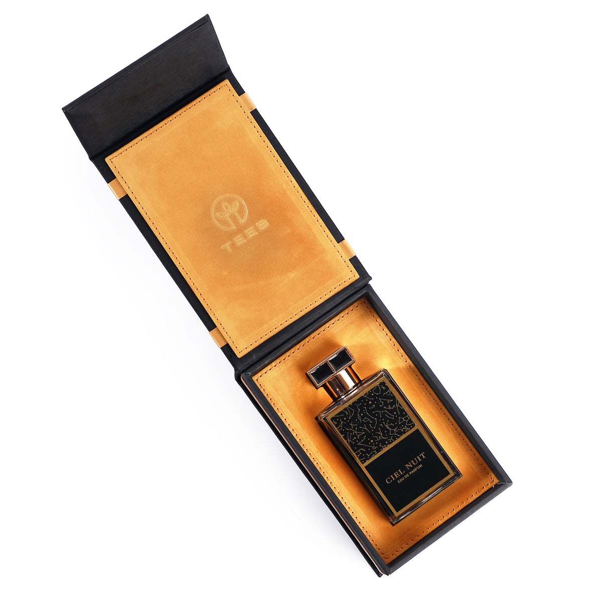 Open black Ciel Nuit gift box with tan lining and the bottle inside, seen from above