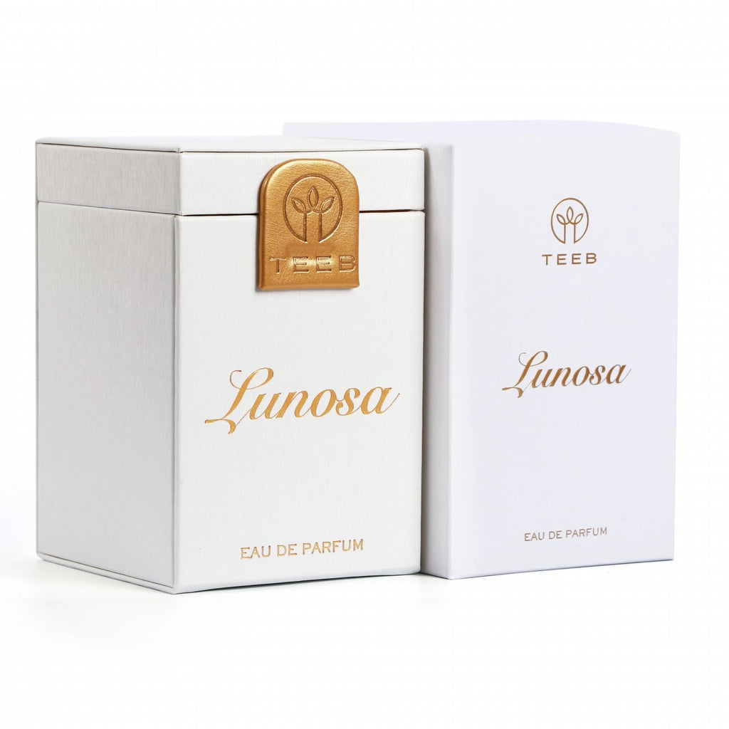 White Lunosa Eau de Parfum boxes with a gold TEEB emblem
